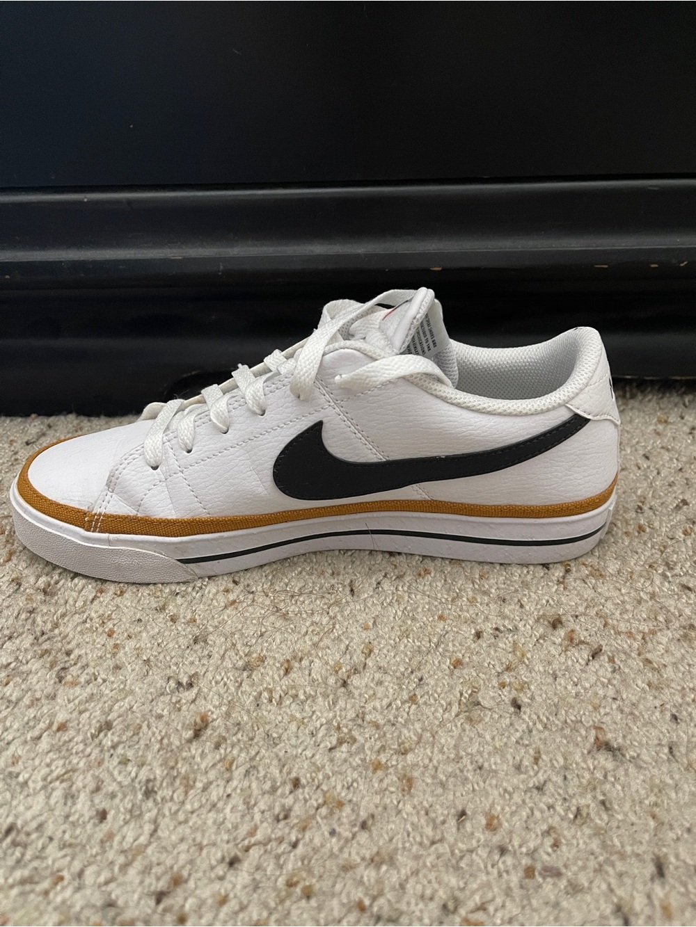 Nike Men’s White Low-Top Sneakers with Black Swoosh and Brown Accent